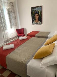 Postel nebo postele na pokoji v ubytování Hotel Migani