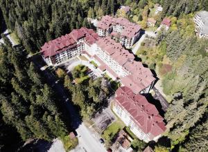 an overhead view of a large house with red roof at Arboro Borovets Gardens E50 in Borovets