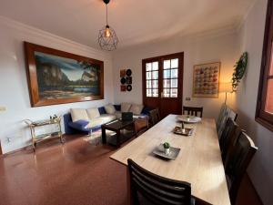 a living room with a table and a couch at CoLiving El Secretario in Las Palmas de Gran Canaria