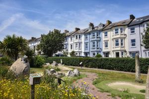 a large building with a garden in front of it at Flat 2, 10 Seafield Road in Seaton