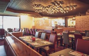 Restoranas ar kita vieta pavalgyti apgyvendinimo įstaigoje Club Hotel Davos by Mountain Hotels