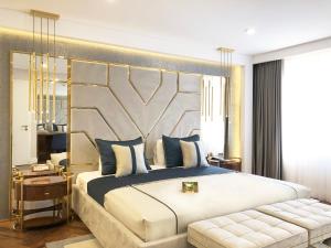 a bedroom with a large bed with a large headboard at AHC Old City Hotel in Istanbul