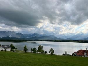 a view of a large body of water with mountains at Bubble Tent Füssen im Allgäu in Füssen
