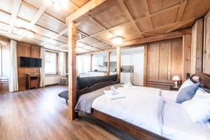 Postel nebo postele na pokoji v ubytování La Tgoma - Hotel & Restaurant