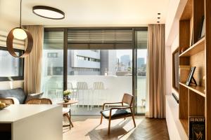 a kitchen and living room with a view of a city at Balcony Bar Skyline View by Sea N' Rent in Tel Aviv
