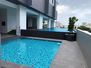 a swimming pool on the side of a building at Melaka Town/Sea View/10 min to Jonker/4-6Pax(2015) in Melaka