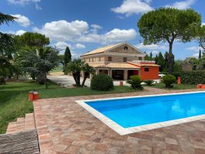 a house with a swimming pool in front of a house at Casale Monte Amato in Tornasano
