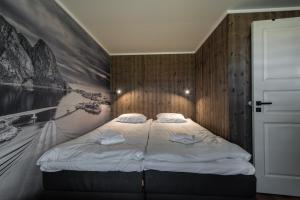 Postel nebo postele na pokoji v ubytování Lofoten Green Studio
