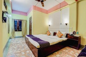 a bedroom with a large bed in a room at SPOT ON Durba 2 in Tezpur