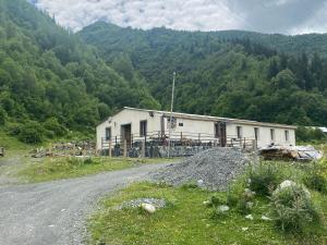 a building on the side of a dirt road at Hotel Dauber in Lalkhori