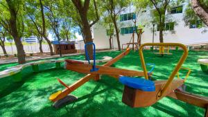 a playground with a slide in a park at NIZA ESPECTACULAR UBICACION VIA BARBASQUILLO in Manta