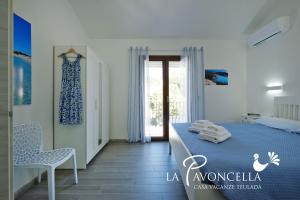 Ένα ή περισσότερα κρεβάτια σε δωμάτιο στο Case Vacanze La Pavoncella