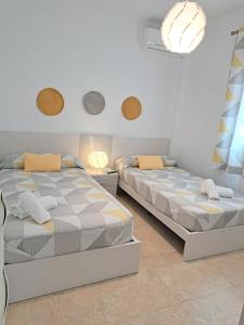 A bed or beds in a room at Villa Las Tres J