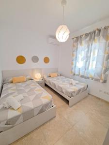 A bed or beds in a room at Villa Las Tres J