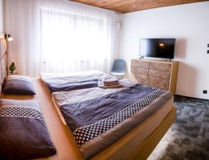 Postel nebo postele na pokoji v ubytování Apartmán Hrabušice
