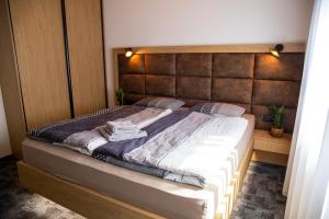 Postel nebo postele na pokoji v ubytování Apartmán Hrabušice