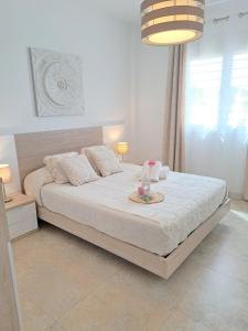 A bed or beds in a room at Villa Las Tres J
