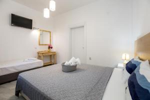 Postel nebo postele na pokoji v ubytování Marti Garden Suites