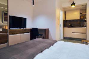 TV i/ili multimedijalni sistem u objektu Cozy and Lovely Apartments I & II