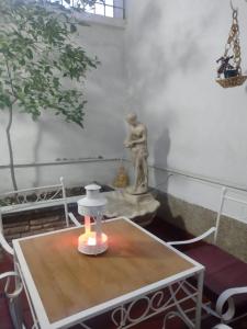 a statue sitting on a table in a room at CASA OLGUITA in Godoy Cruz