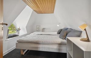 a white bedroom with a bed and a window at Gorgeous Home In Middelfart With Wifi in Middelfart