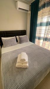 Säng eller sängar i ett rum på Appartement Résidence Yassmina