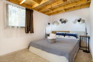 Postel nebo postele na pokoji v ubytování Marti Garden Suites