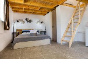 Postel nebo postele na pokoji v ubytování Marti Garden Suites