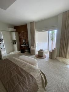 a bedroom with a bed and a view of the ocean at Villa design vue panoramique in Grabels