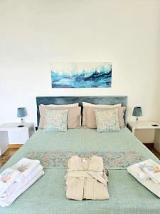 a bedroom with a bed with towels on it at La Stella dei Venti B&B in Naples