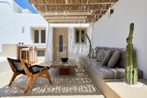 a living room with a couch and a table at U & ME SUITES in Fira
