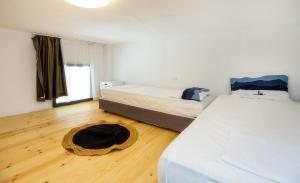 Postel nebo postele na pokoji v ubytování Marti Garden Suites