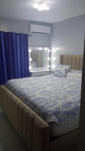 Postel nebo postele na pokoji v ubytování Apartamento Santo Domingo Norte