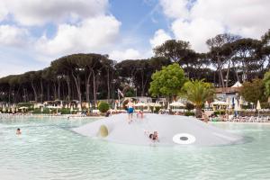 a group of people on a large object in the water at Fabulous village in Casal Palocco