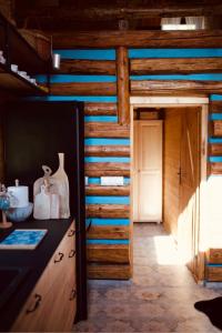 a room with a wooden cabin with a counter and a door at Ranczo nad Cedronem in Kalwaria Zebrzydowska