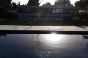 a pool of water in front of a house at Boutique Bus close to Tel Aviv and BG Airport, 