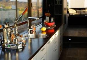 a kitchen with a sink and a counter top with a sink at Boutique Bus close to Tel Aviv and BG Airport, 