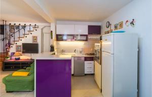 a kitchen with a white refrigerator and a purple counter top at Holiday Home Sucuraj 06 in Sućuraj +21 photos