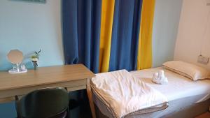 Letto o letti in una camera di DONG’HOME东东小院