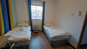 Letto o letti in una camera di DONG’HOME东东小院