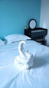 Letto o letti in una camera di DONG’HOME东东小院