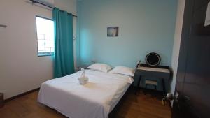 Letto o letti in una camera di DONG’HOME东东小院