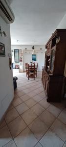 a living room with a table and chairs in it at Casa Fiorella in Stiava