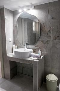 a bathroom with a sink and a mirror at Aktia Apartments, Preveza in Preveza