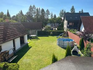 an aerial view of a yard with a pool at A&A Apartmany in Liptovský Mikuláš