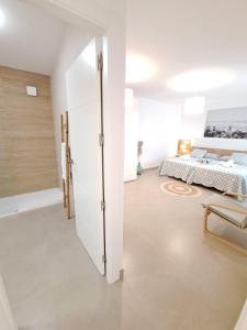 A bed or beds in a room at Villa Las Tres J