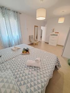 A bed or beds in a room at Villa Las Tres J