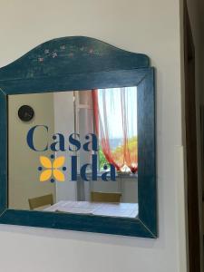 a mirror on a wall with a cason label at Amalfi Coast Casa Ida in Vietri sul Mare