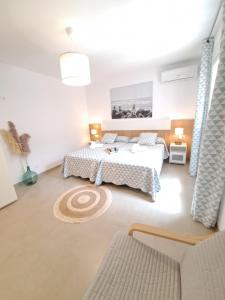 A bed or beds in a room at Villa Las Tres J