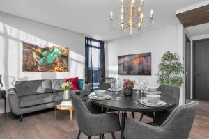 a living room with a table and a couch at ALVA Apartments in Reykjavík